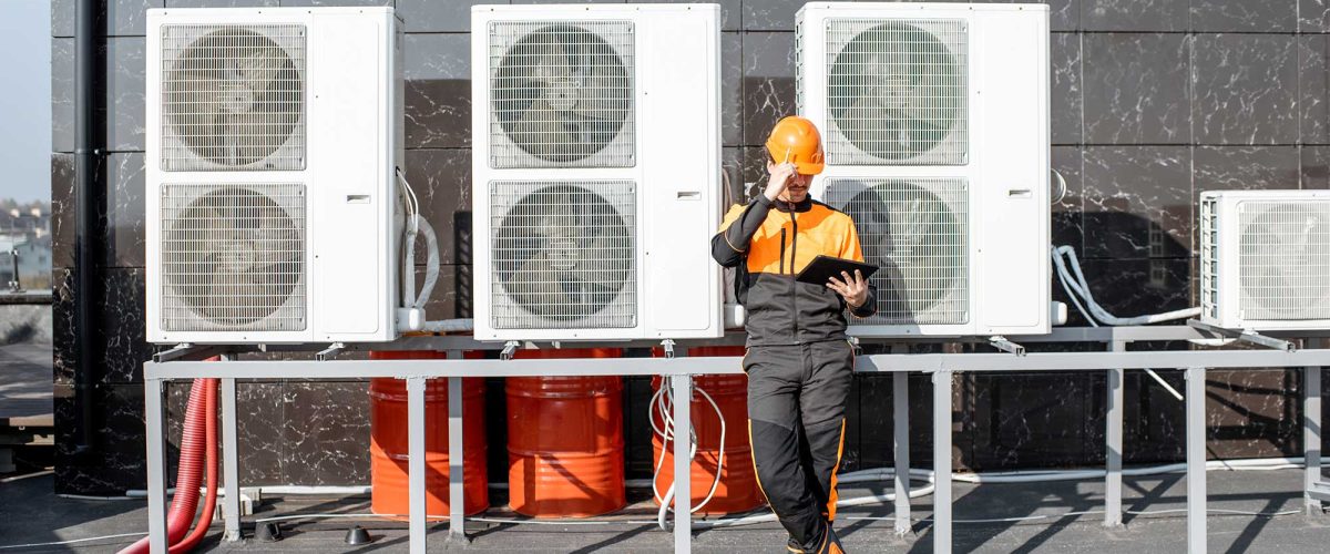 workman-servicing-air-conditioning-or-heat-pump-wi-2021-09-01-16-05-40-utc